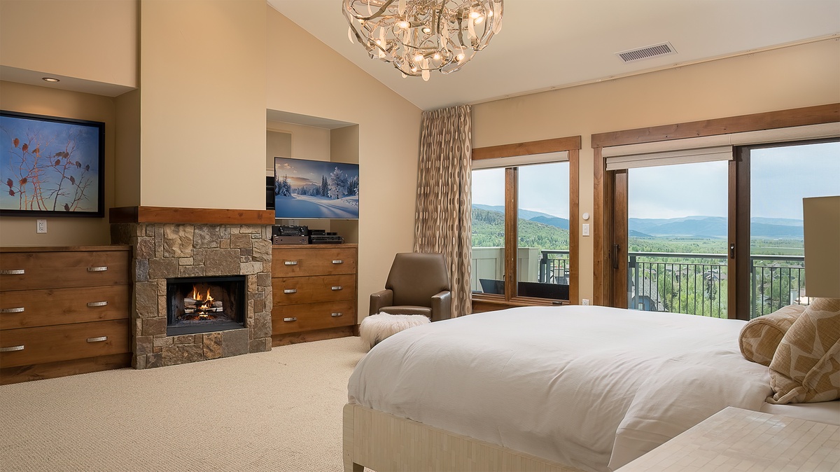 Bedroom 1, Main Level - Primary king bedroom with fireplace and TV