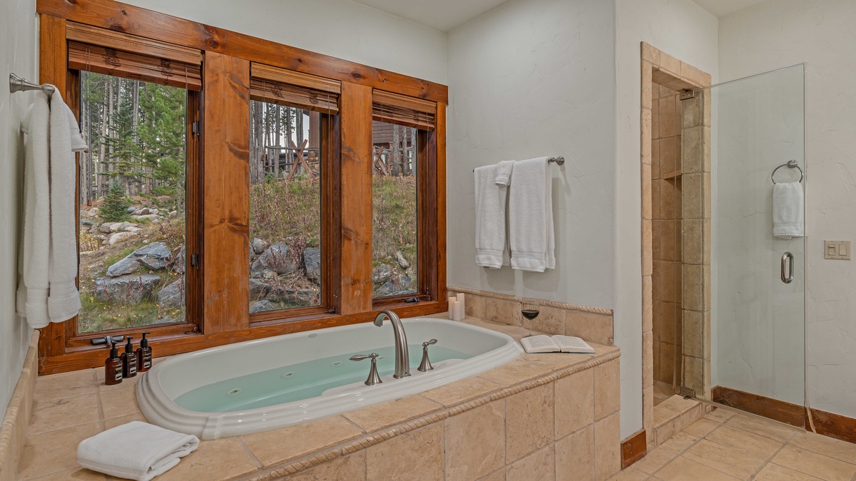 Bedroom 1, Main Level - Primary ensuite with soaking tub and shower