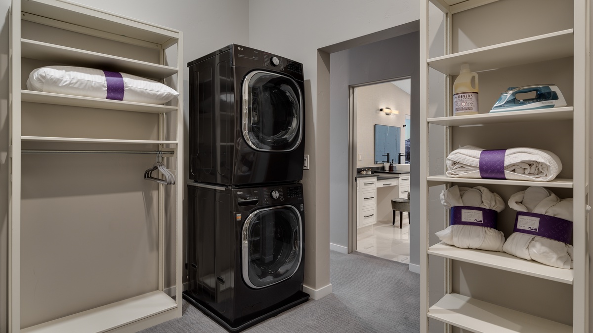 Primary walk-in closet with washer & dryer