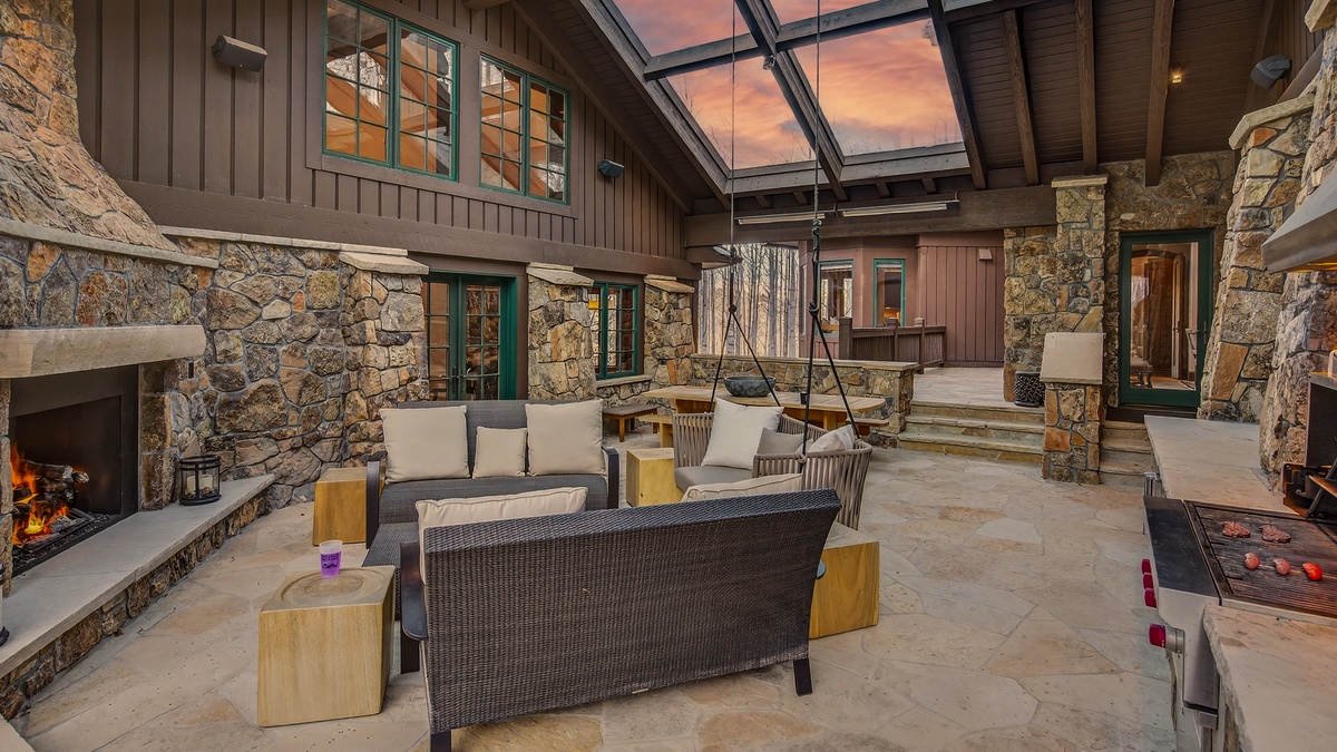 Patio, Main Level - Covered outdoor living space with comfortable seating and fireplace