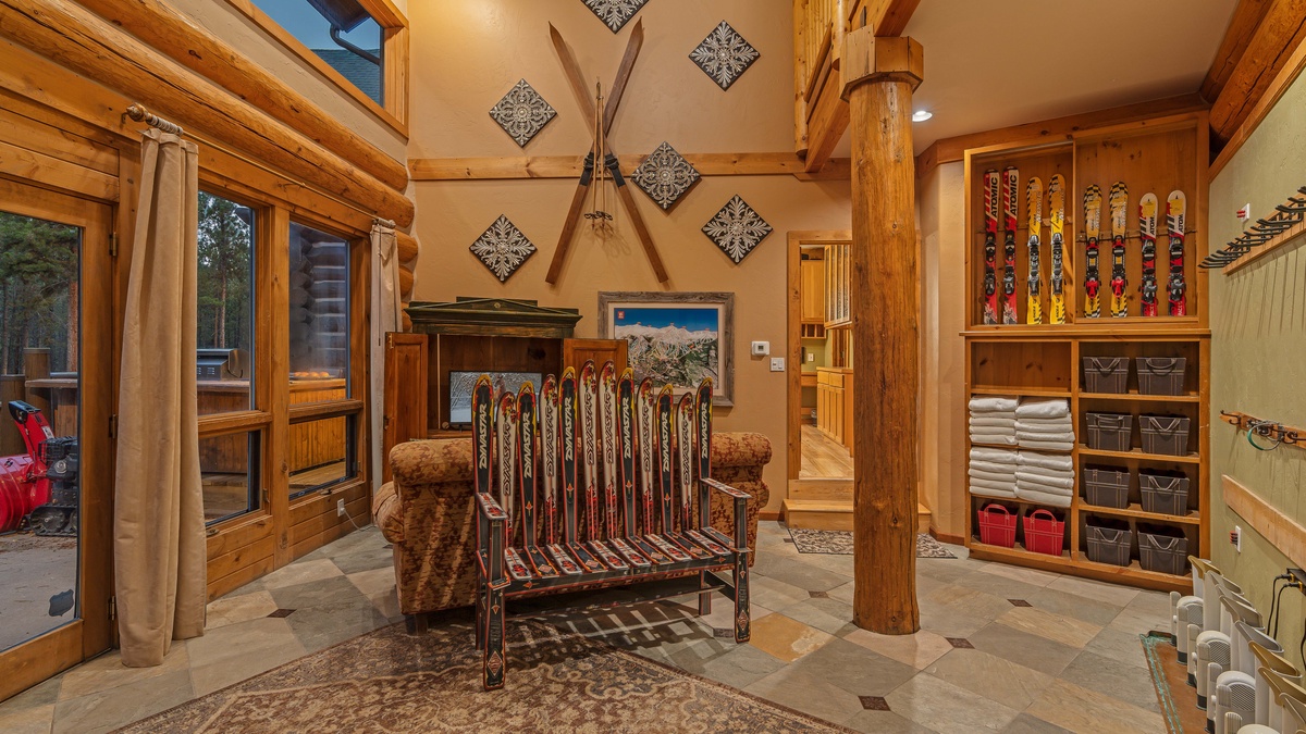 Mudroom on main level with access leading to ski run