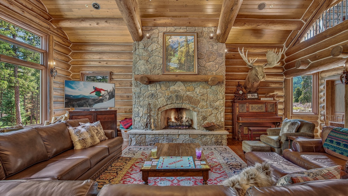 Great Room, Main Level - Stone fireplace with TV and seating area