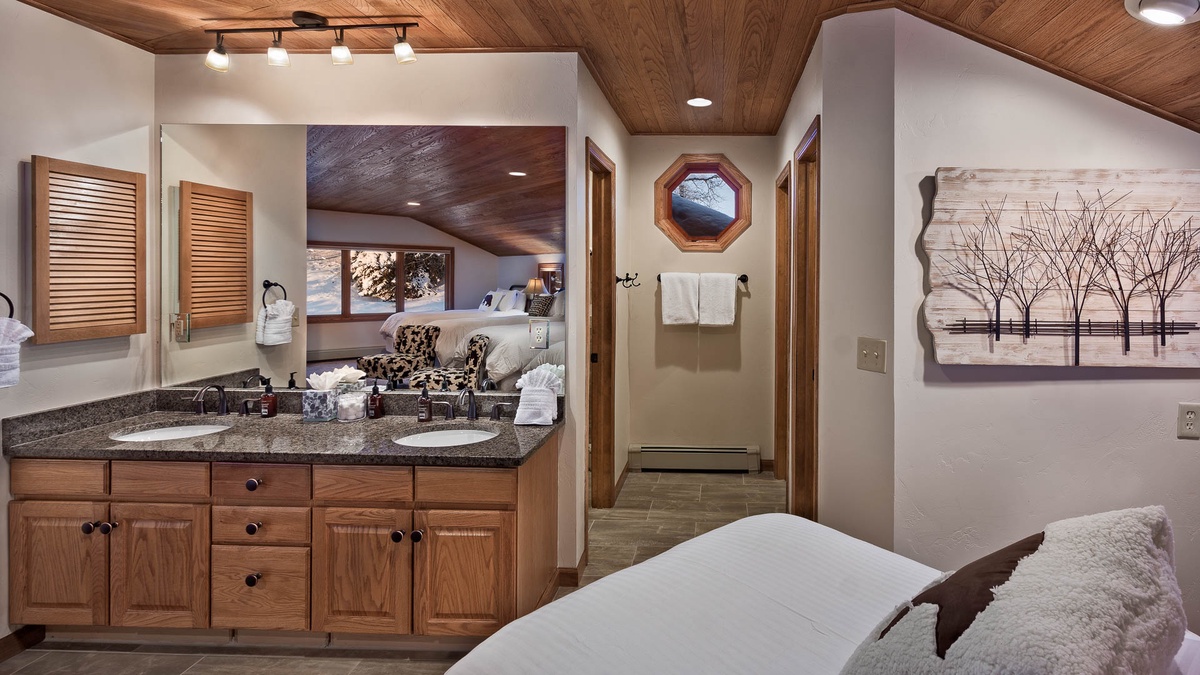 Dorm bathroom has two sinks, two toilets and one shower