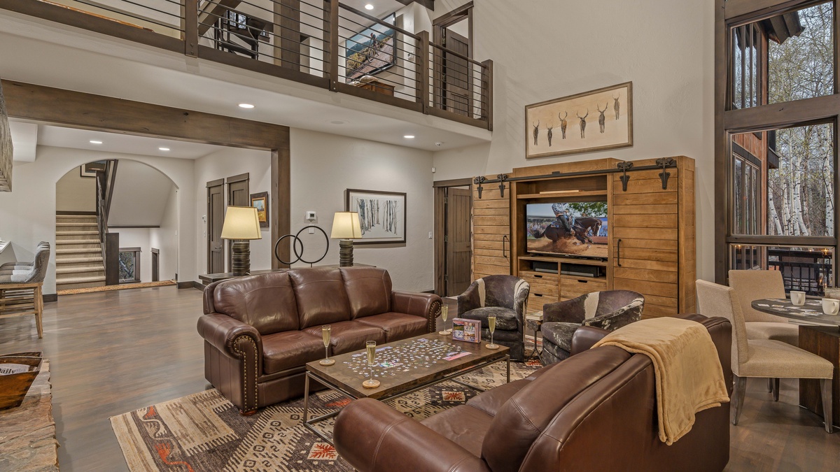 Open great room with TV and plenty of comfortable seating
