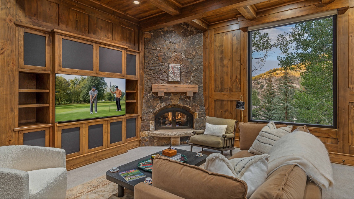 Media/Office on main level with gas fireplace and TV