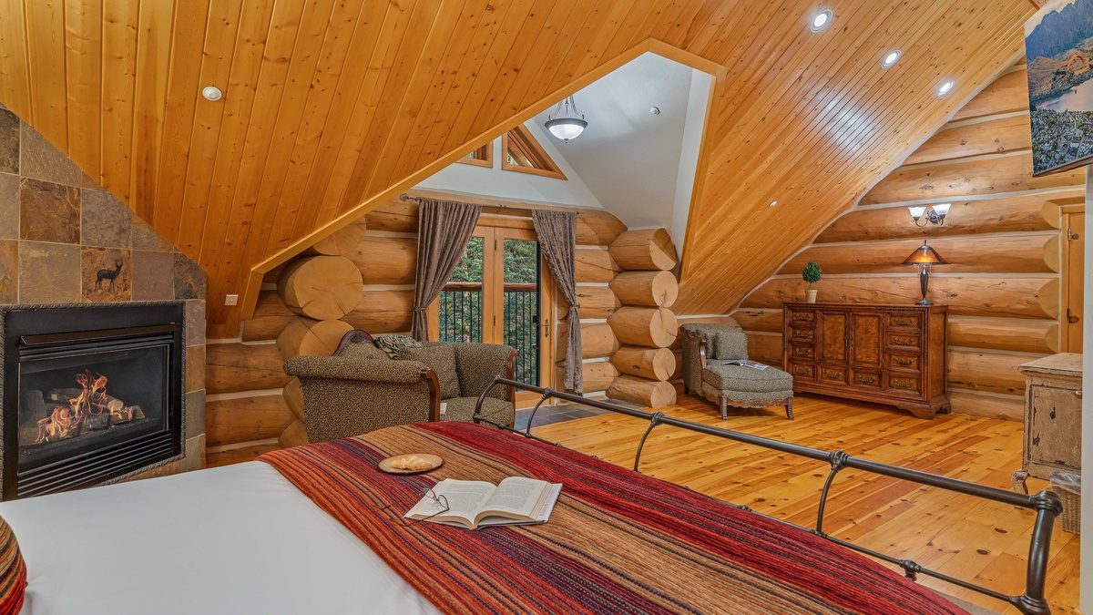 Bedroom 1, Upper Level - Primary king suite with TV and gas fireplace