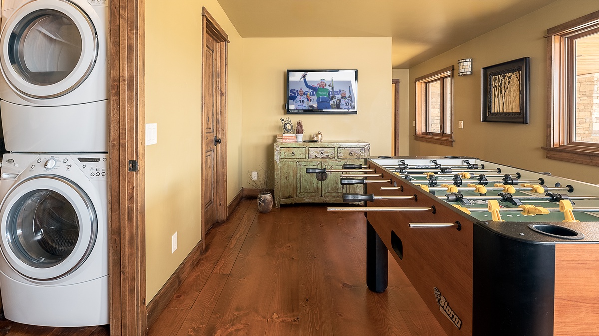 Your private game room awaits with foosball and laundry convenience, perfect for unwinding after a day of mountain adventures.