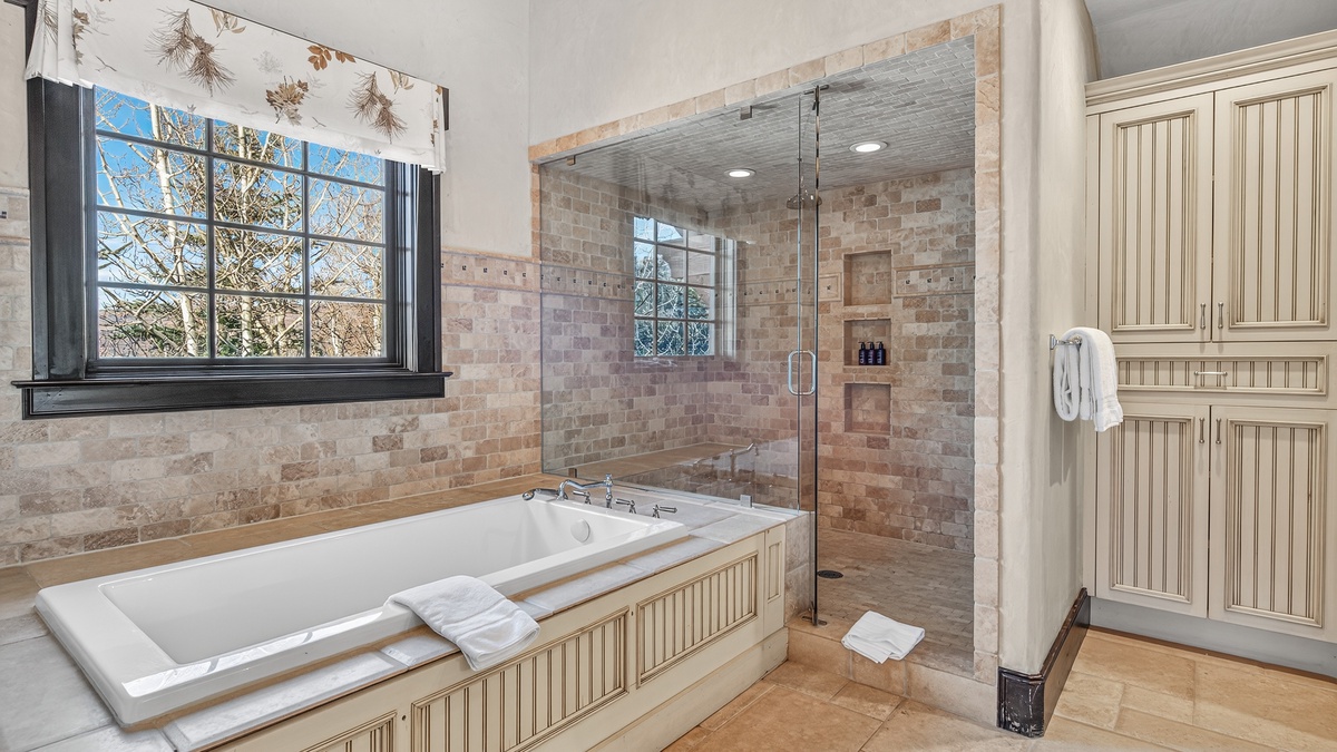 Bedroom 1, Main Level - Primary king ensuite bathtub and shower