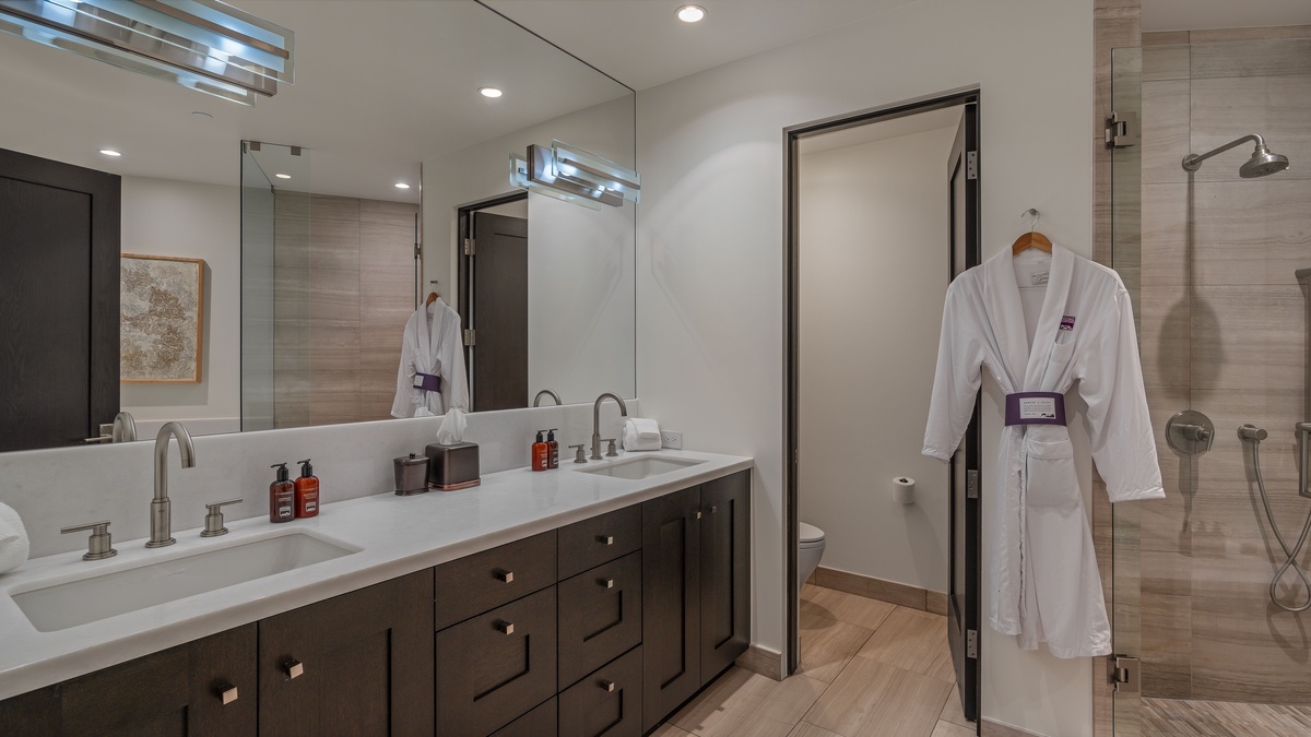 Bedroom 1, Upper Level - Primary ensuite with double sinks, shower, and large tub