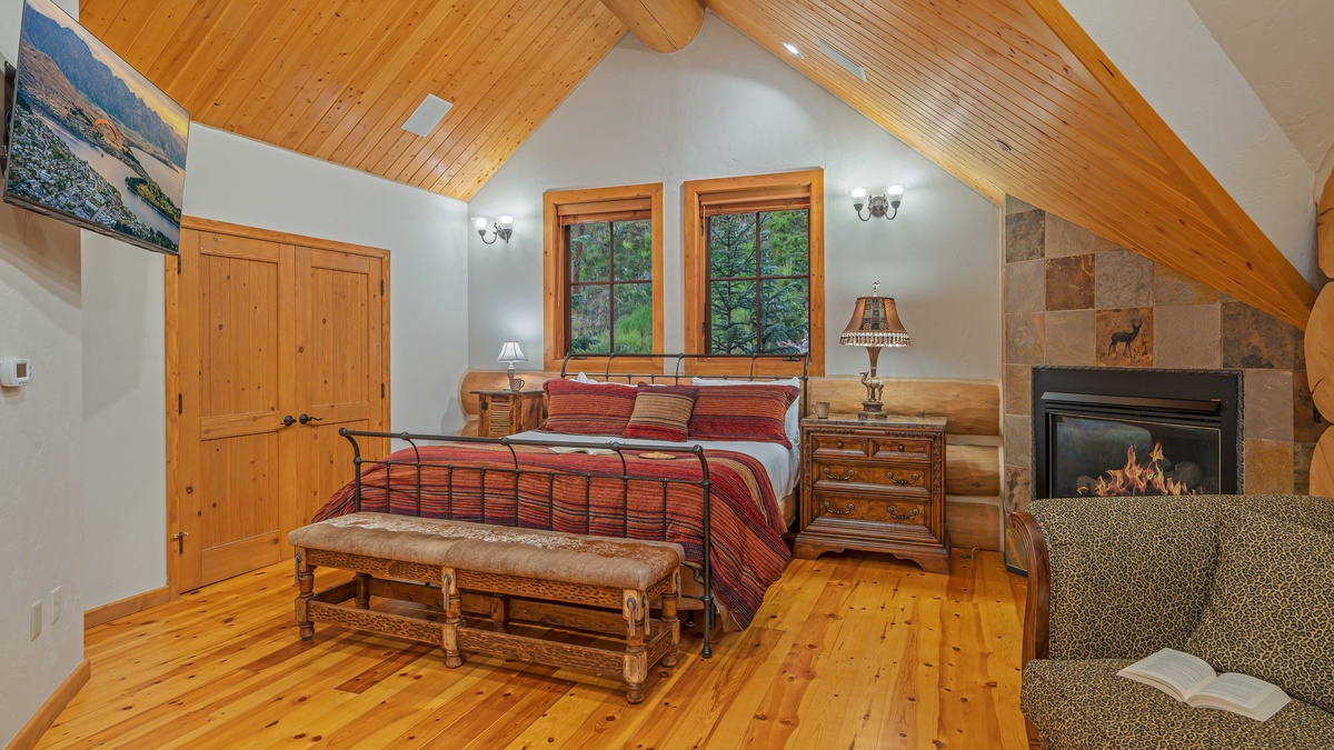 Bedroom 1, Upper Level - Primary king suite with TV and gas fireplace