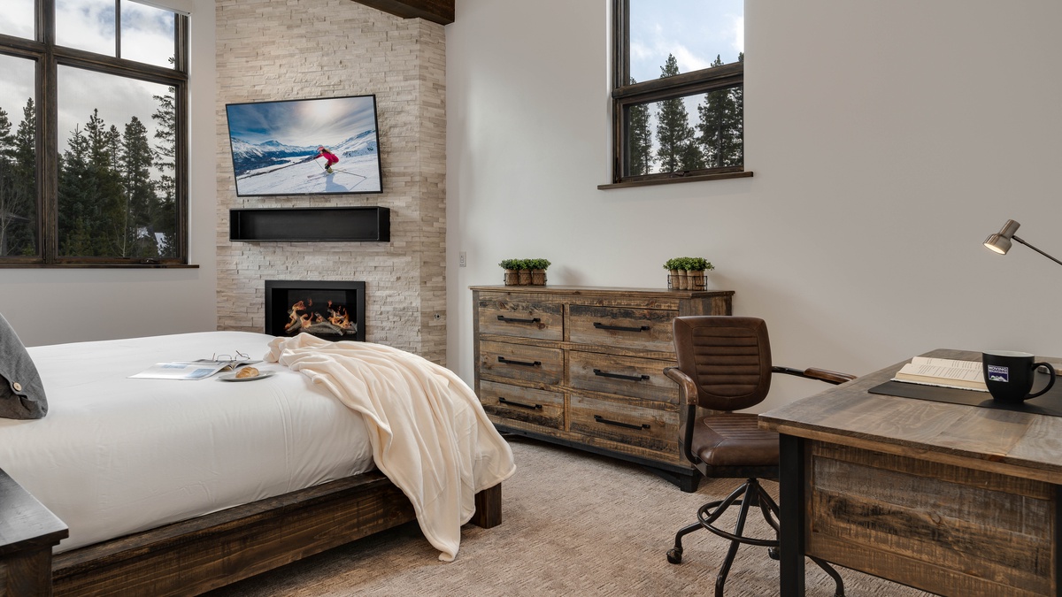 Bedroom 1, Main Level - Primary bedroom with fireplace and desk