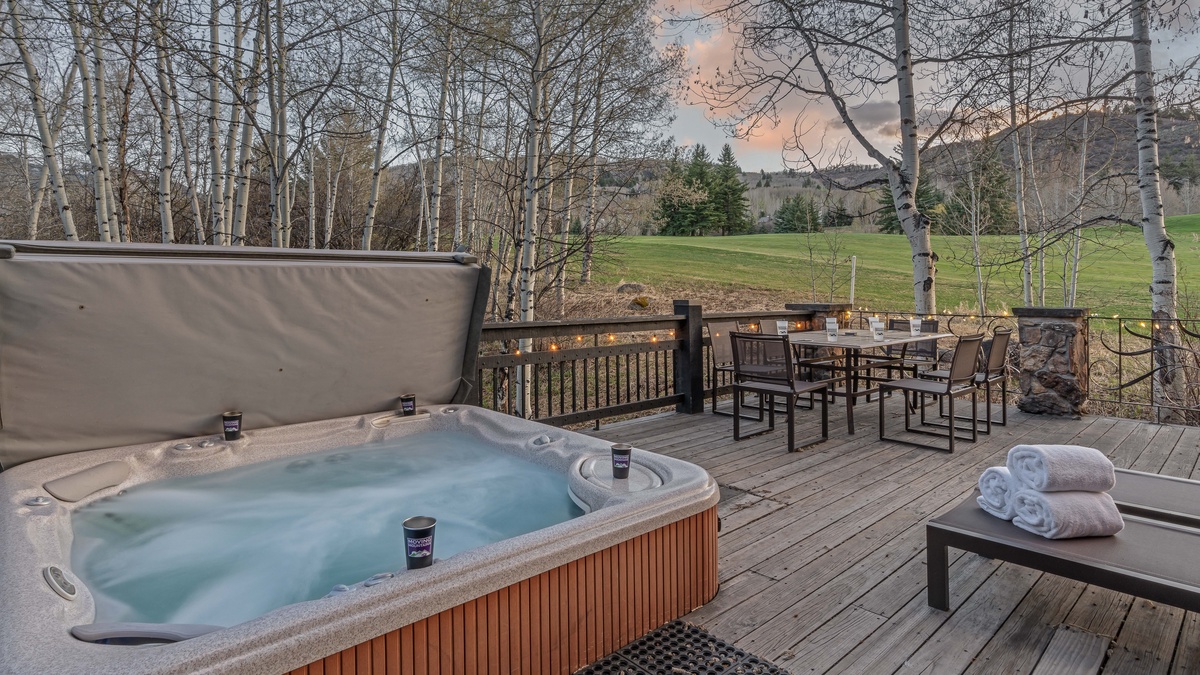 Enjoy sunset on the main deck with hot tub and seating