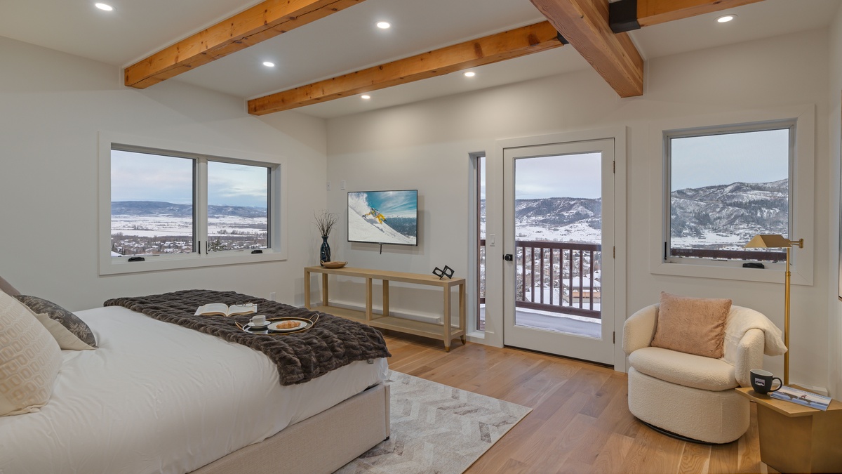 Primary king suite on main level with balcony access