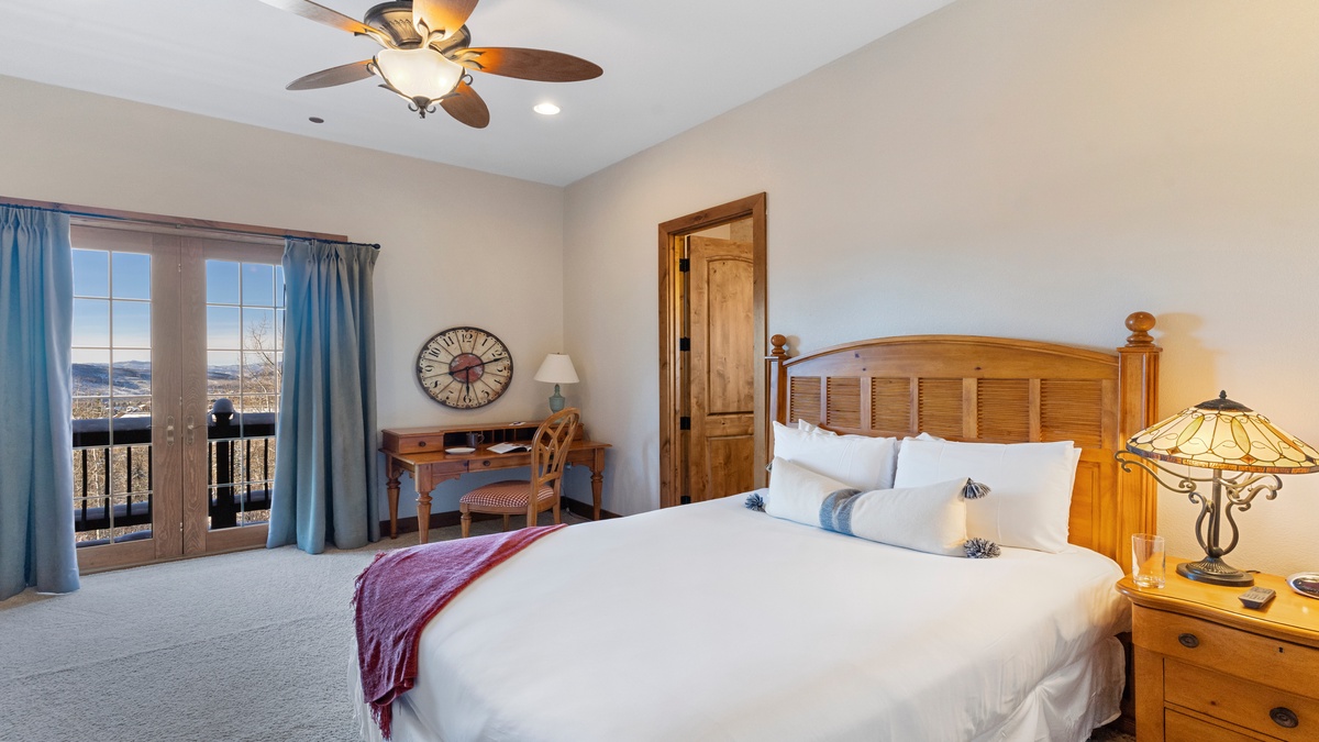 Main level queen suite 2 with deck access