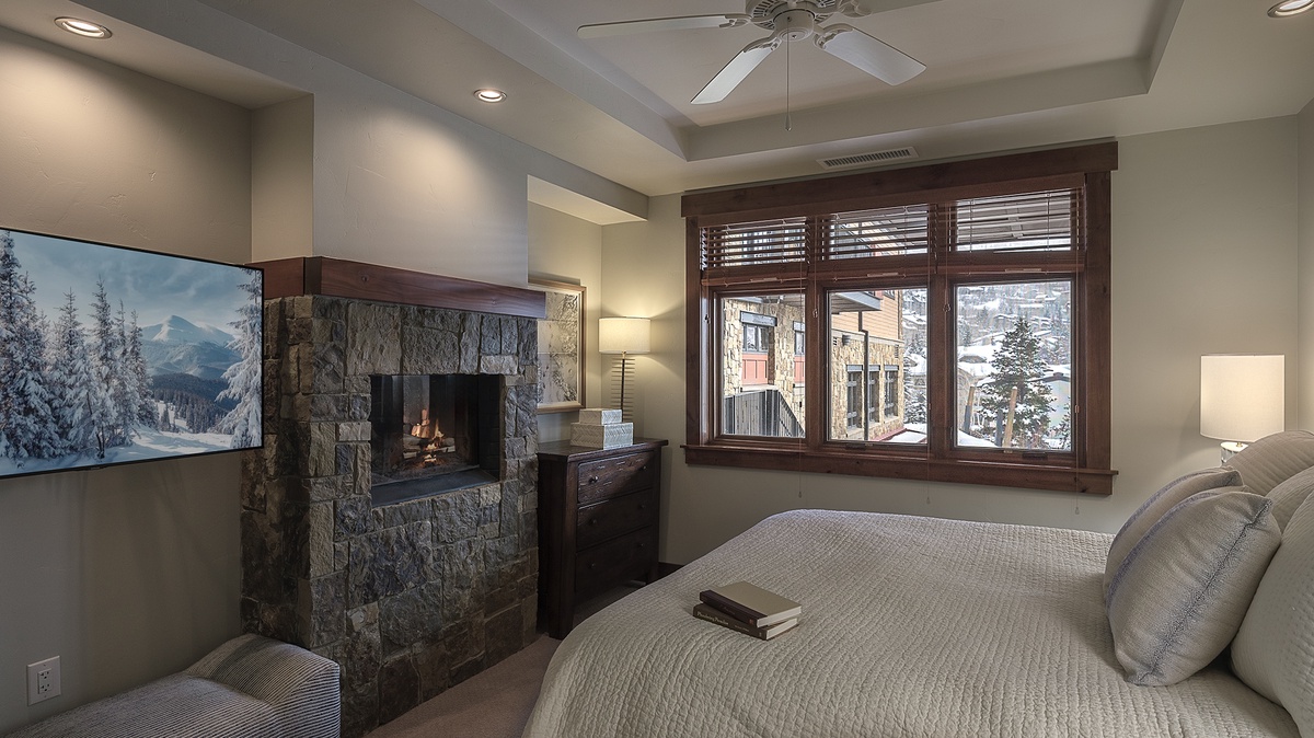 Bedroom 1, Main Level - Primary bedroom suite with king bed and fireplace