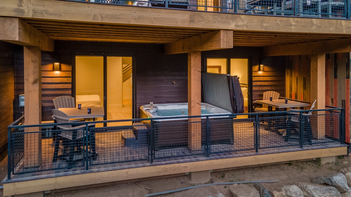 Hot Tub, Lower Level - View of the lower deck and hot tub, with direct access to both lower level bedrooms
