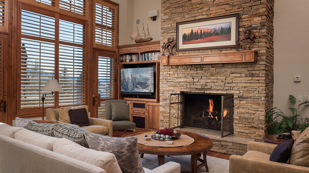 Great Room, Main Level - Stone fireplace with expansive windows and cozy seating