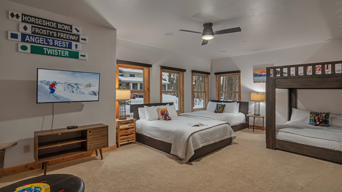 Bedroom 2, Lower Level - Bunkroom with 2 queen beds, TV, and fireplace on lower level