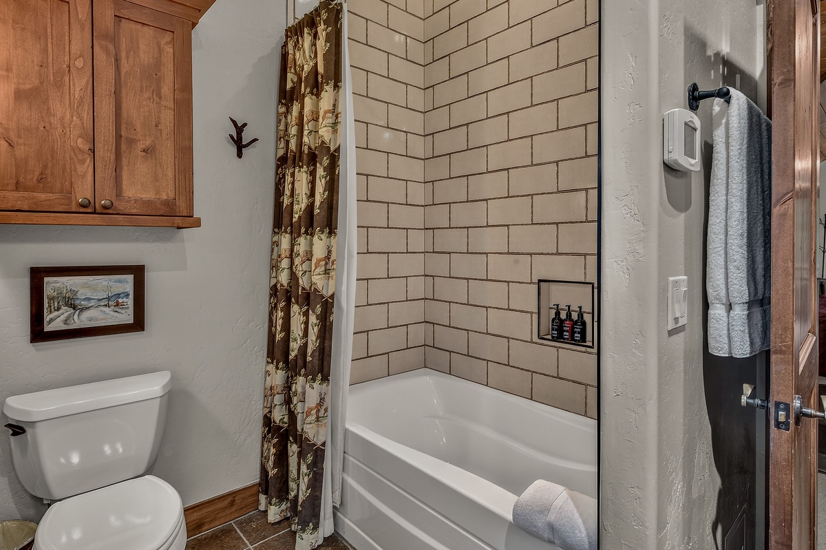 Bedroom 1, Upper Level - Primary ensuite with shower/tub combo