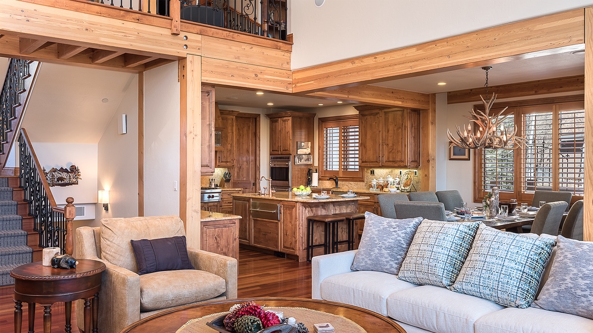 Great Room, Main Level - Inviting lounge space with exposed beams and adjacent kitchen
