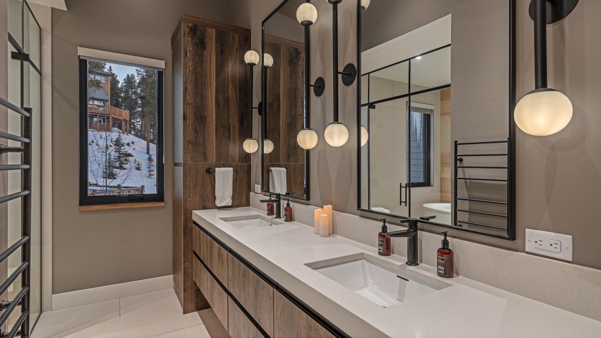 Bedroom 1, Main Level - Primary king ensuite with double sinks and modern finishes