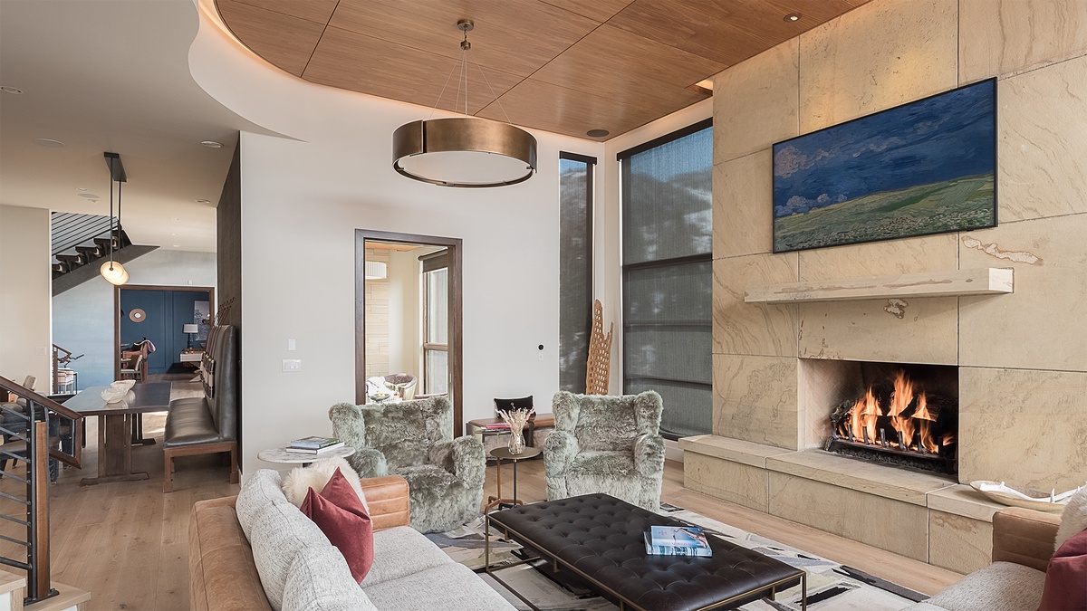 Great Room, Main Level - Seating area with fireplace and modern lighting