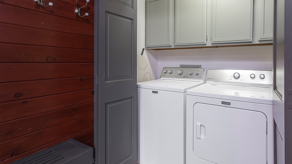 Laundry, Lower Level, Glacier Lodge East - Washer and dryer with overhead cabinets