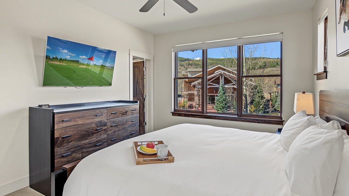 Bedroom 1, Main Level - Primary king bedroom with TV and mountain views