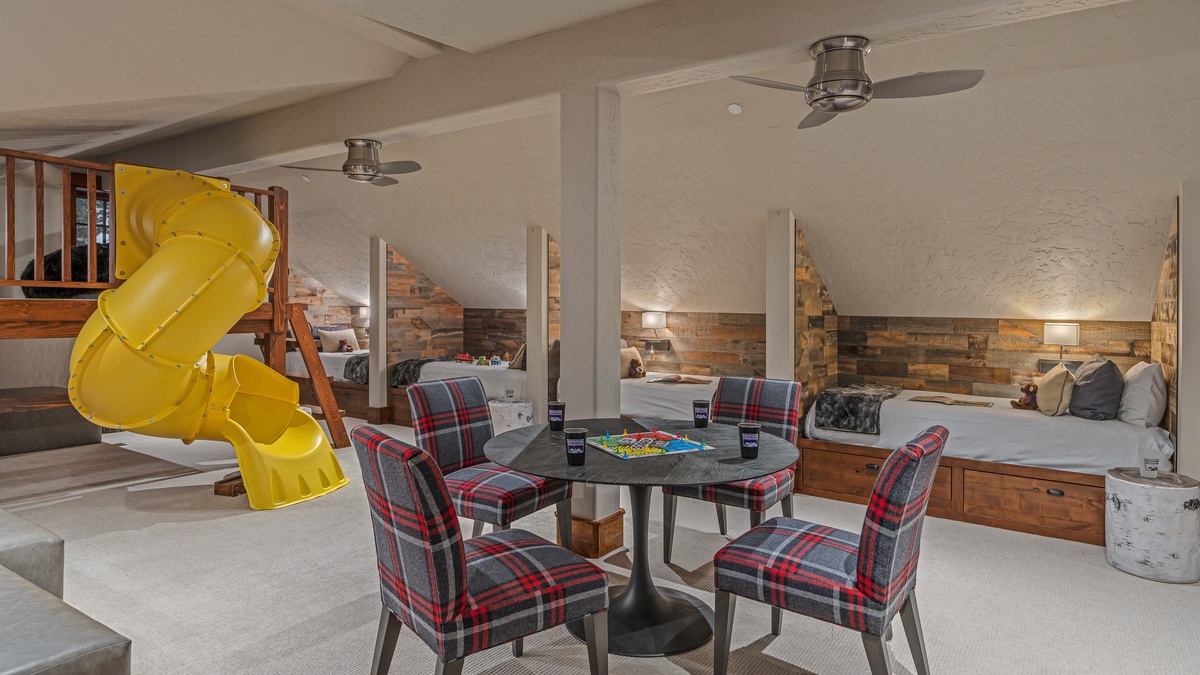 Amazing kids' bedroom on upper level with a fun slide! Sleeps 7