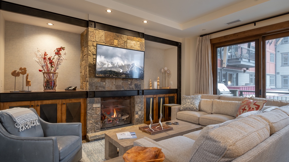 Great Room, Main Level - Fireplace feature wall with mounted TV and sectional seating