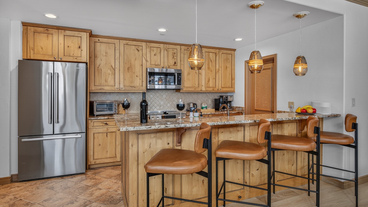 Kitchen, Main Level - With four barstools
