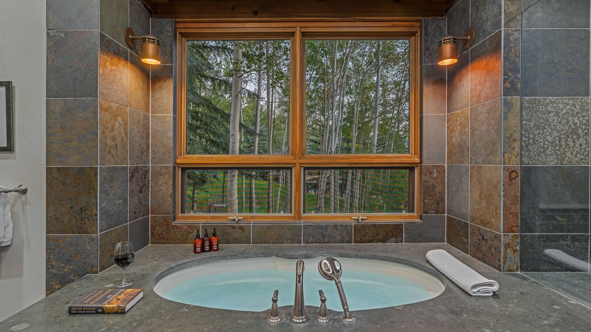 Bedroom 1, Main Level - Primary ensuite with soaking tub