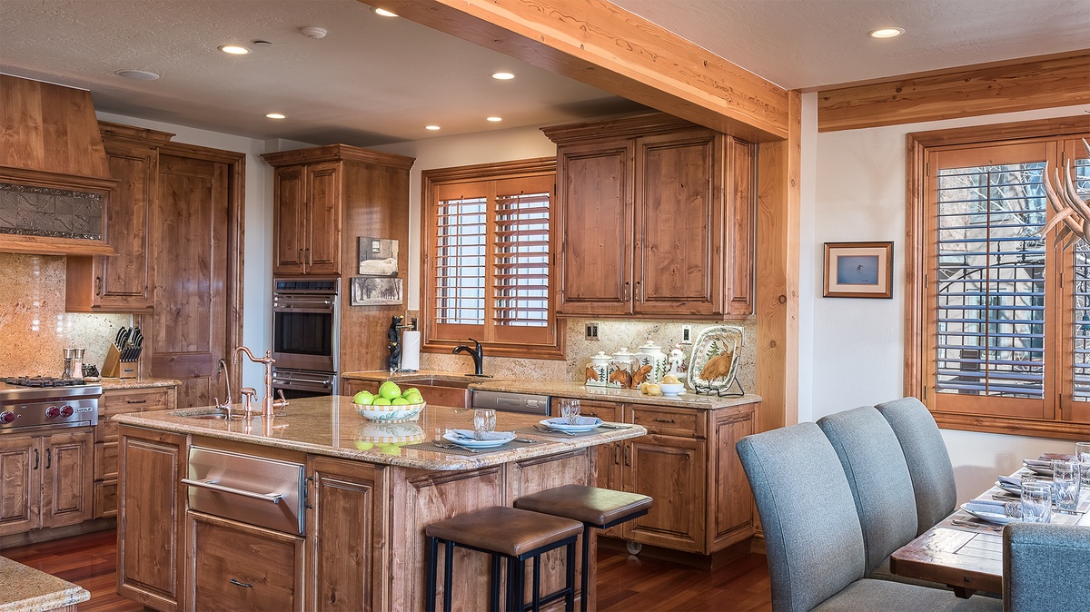 Kitchen, Main Level - Kitchen island with bar seating and wood cabinetry