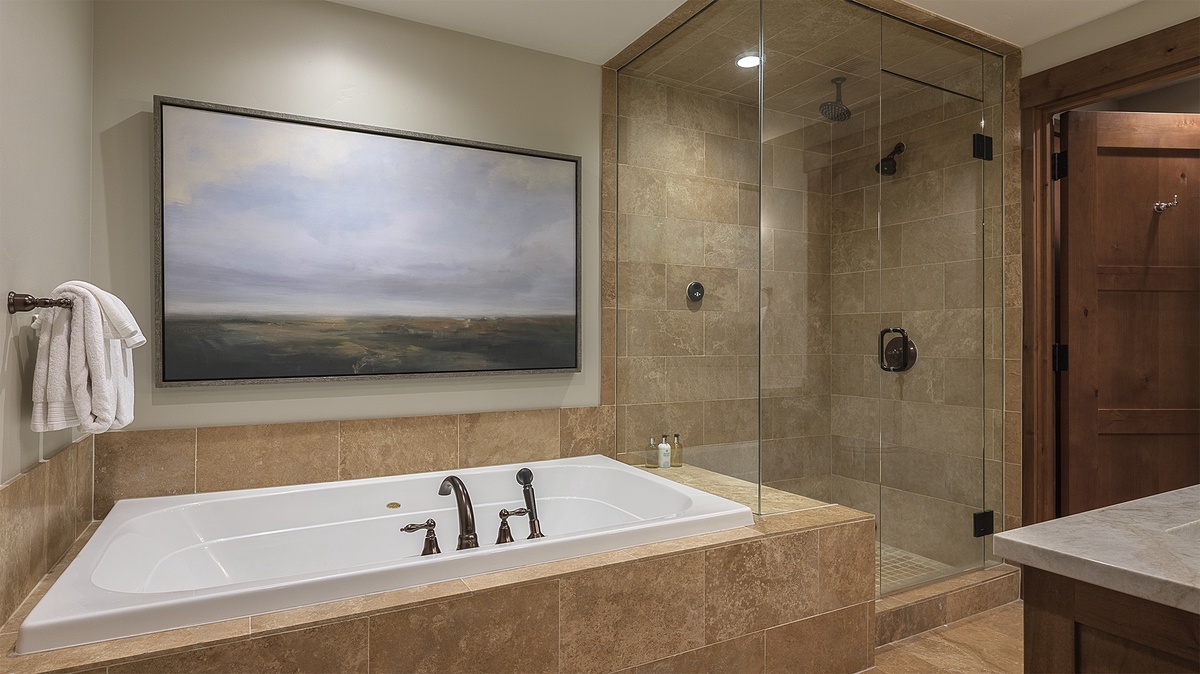 Bedroom 1, Main Level - Primary ensuite with soaking tub and separate shower