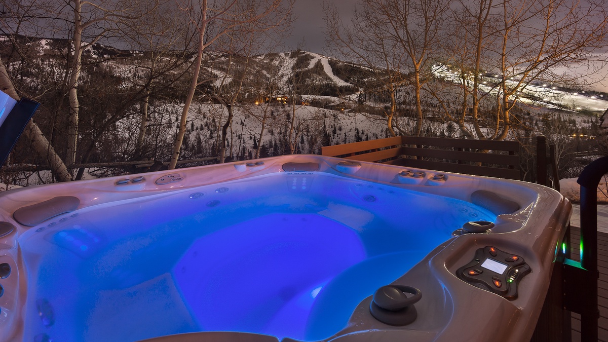 Private hot tub on lower patio with mountain views