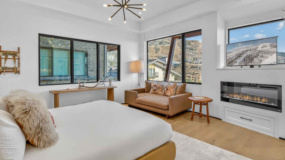 Bedroom 1, Main Level - Primary king suite with fireplace and mountain views