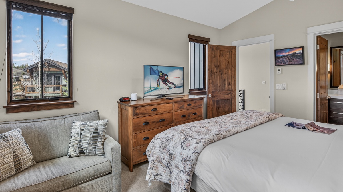 Bedroom 2, Upper Level - King bedroom with dresser and chair