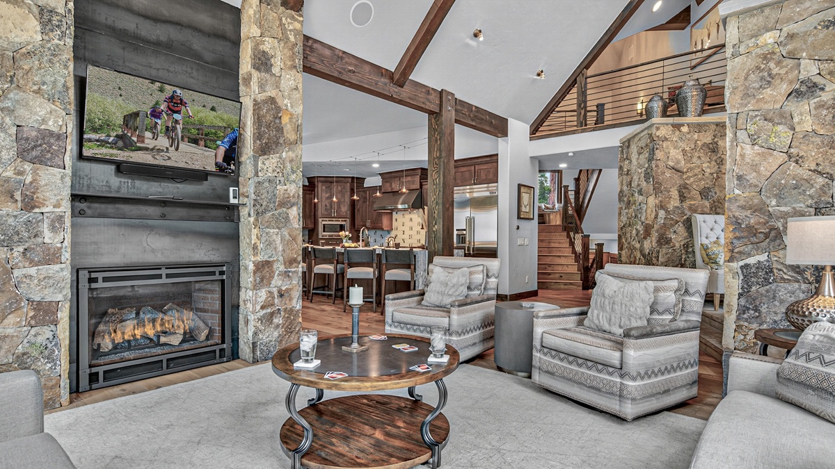 Great Room, Main Level - Open-concept living area with fireplace and kitchen views