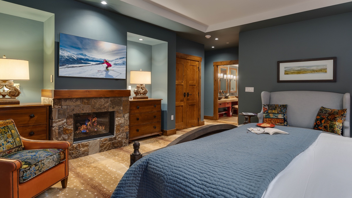 Bedroom 1, Main Level - Primary king suite with TV and fireplace