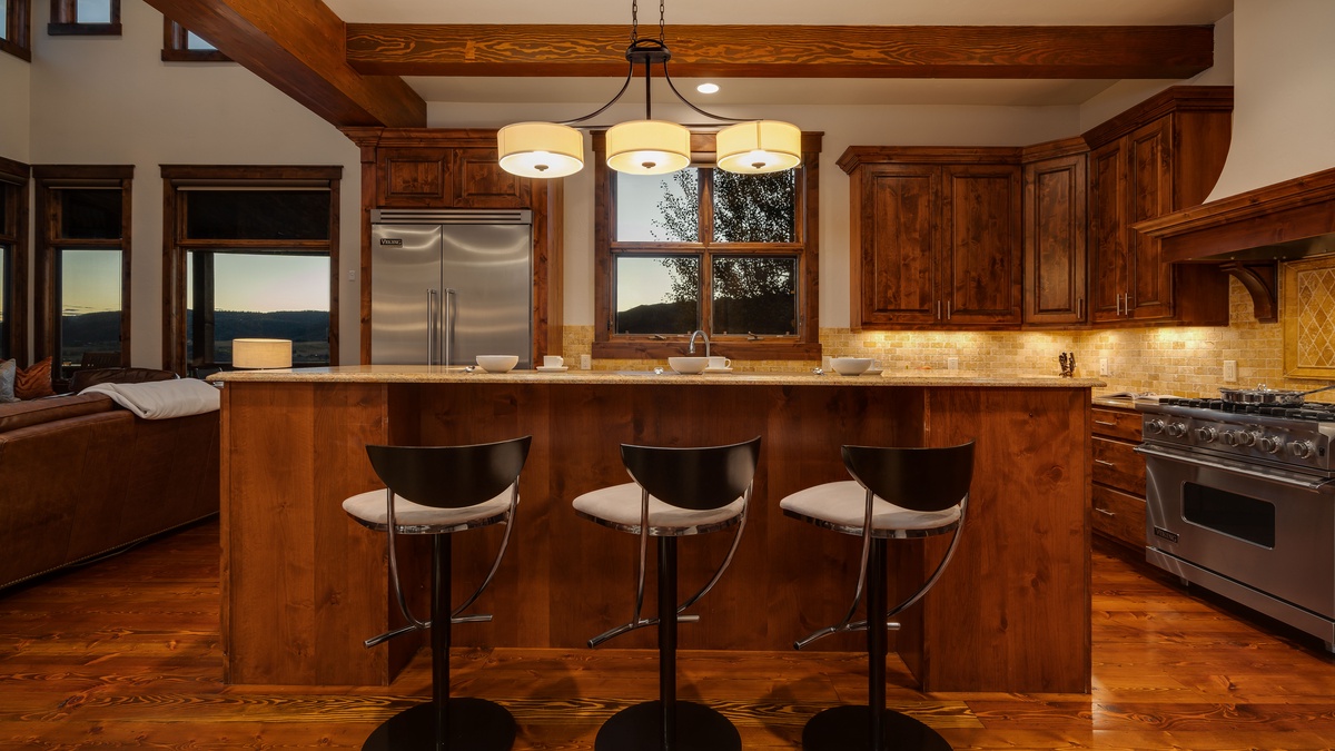 Kitchen, Main Level - Breakfast bar with pendant lighting and seating for three