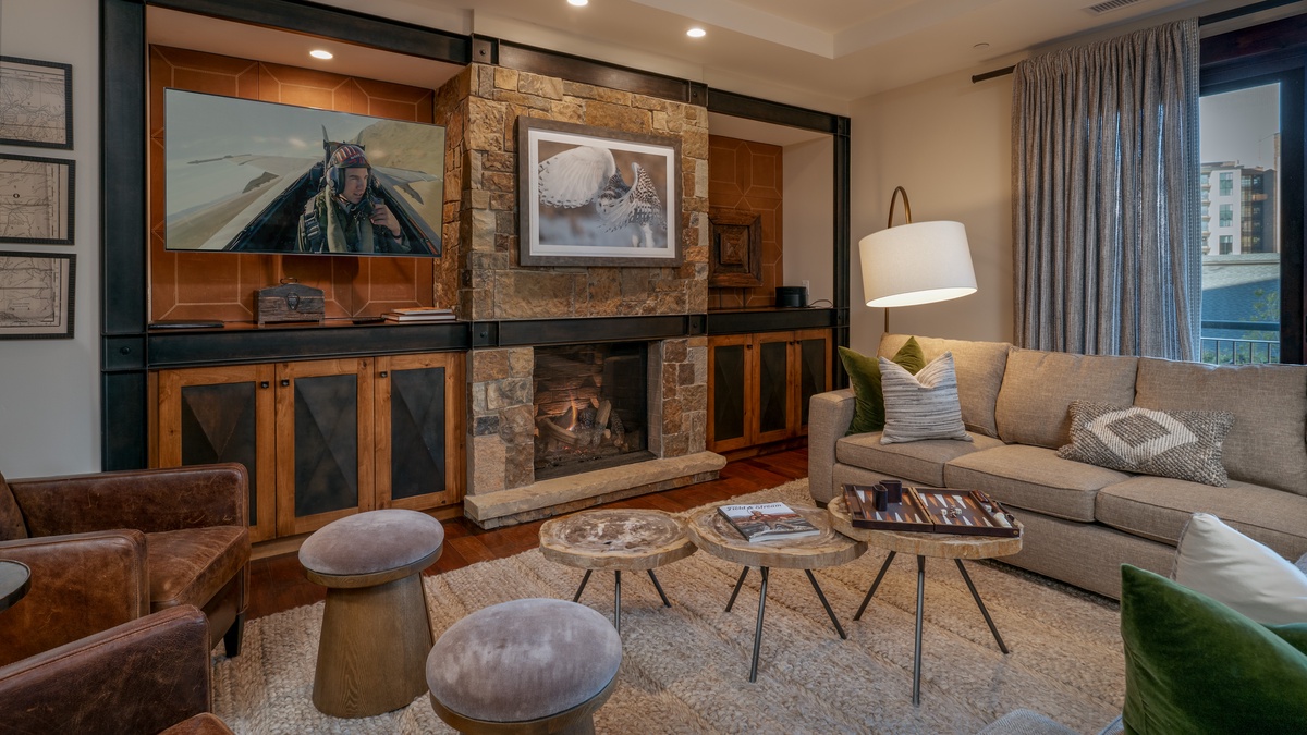 Great Room, Main Level - Fireplace with TV and deck access