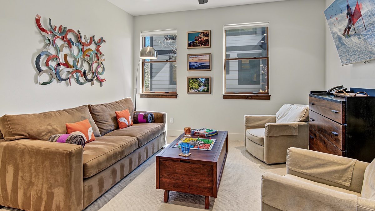 Family Room, Lower Level - Sofa seating with armchair and coffee table