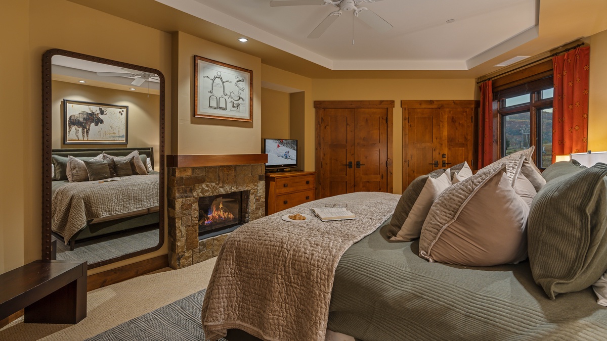 Bedroom 1, Main Level - Primary king suite with fireplace and TV
