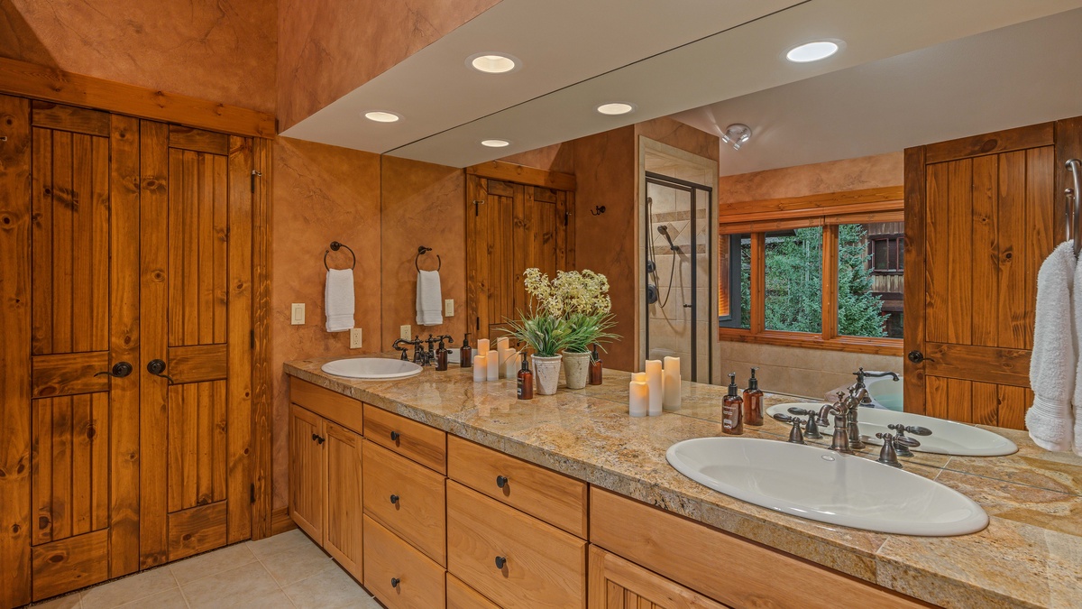 Bedroom 1, Upper Level - Primary king ensuite with double vanities, shower, and soaking tub
