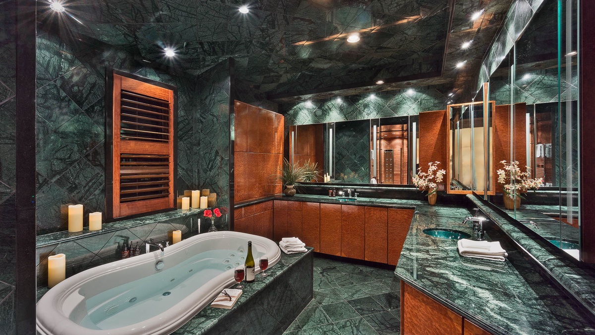 Bedroom 1, Main Level - Primary ensuite with soaking tub and access to massive closet