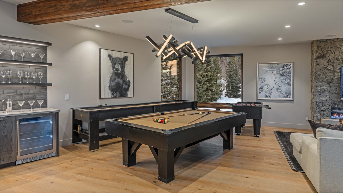 Billiards, shuffleboard, and foosball on the mid-level family room