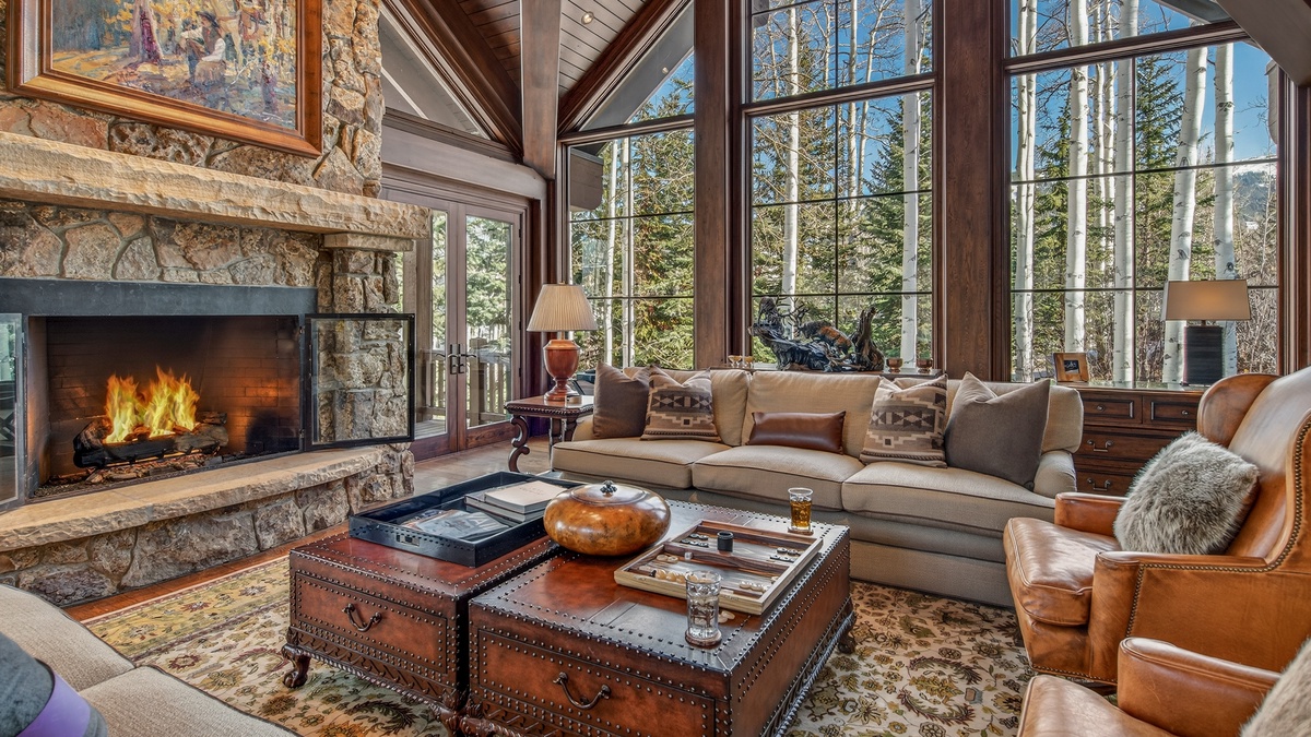 Great Room, Main Level - Open living space with large windows and comfortable seating with mountain views