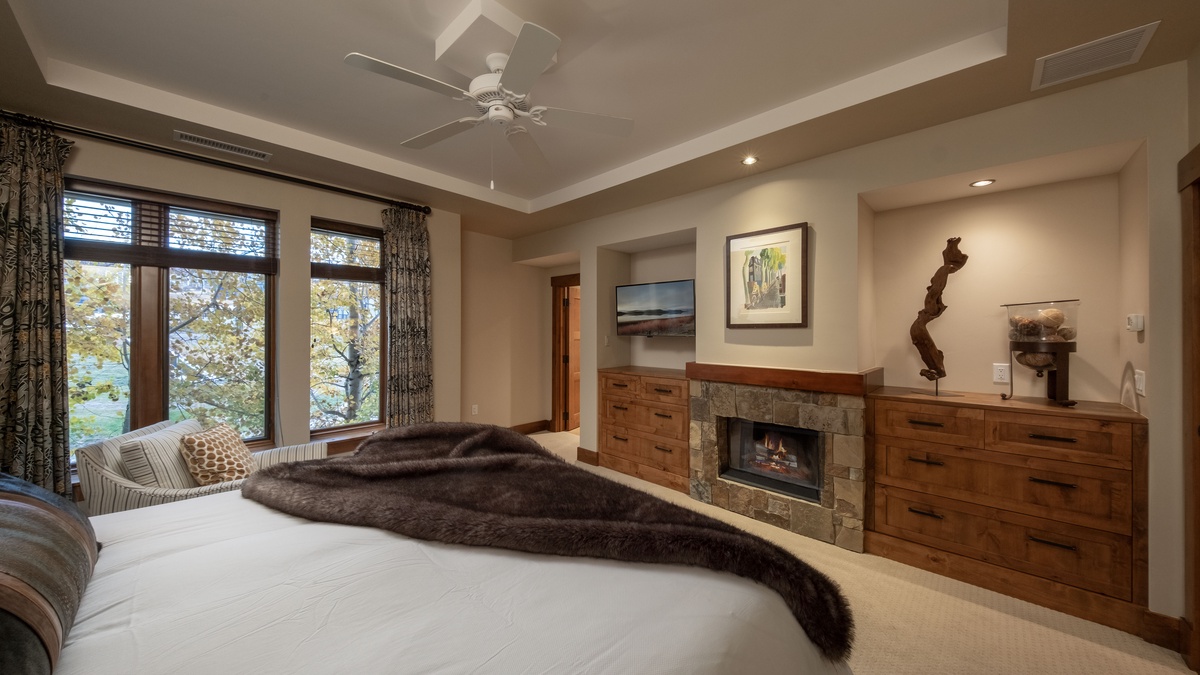 Bedroom 1, Main Level - Primary king suite with fireplace and TV