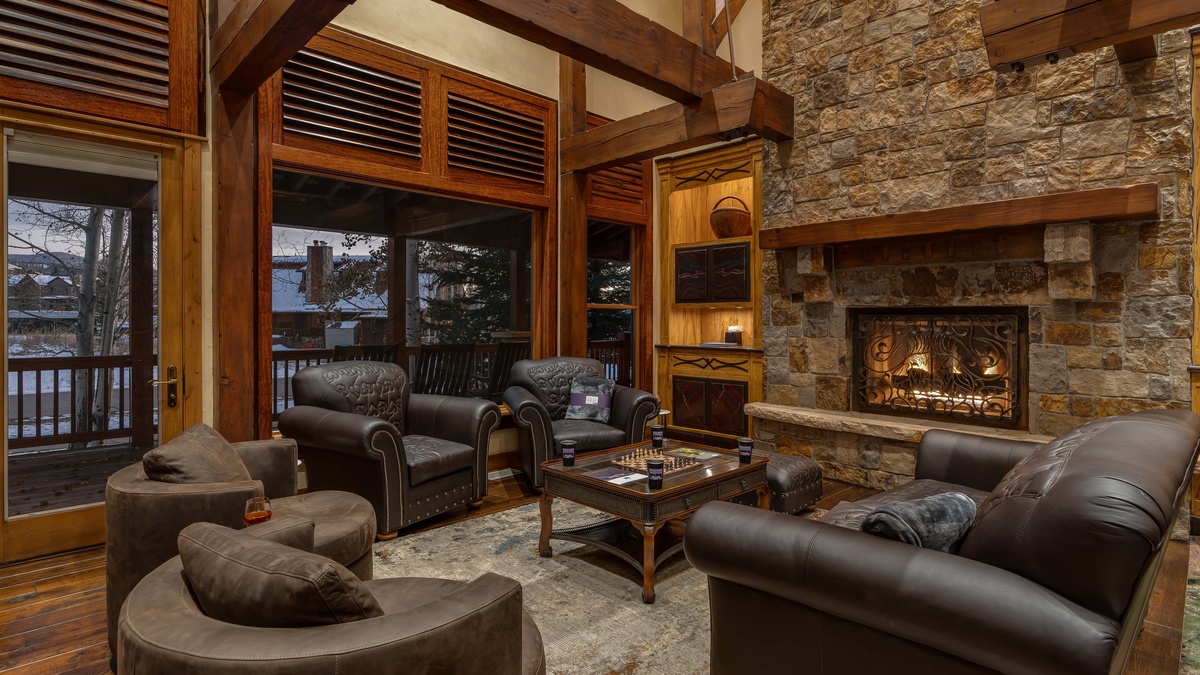 Great Room, Main Level - Spacious seating with plush sofas around the stone fireplace