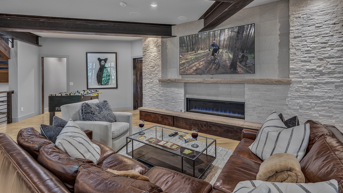Family Room, Lower Level - Fireplace with TV and seating area